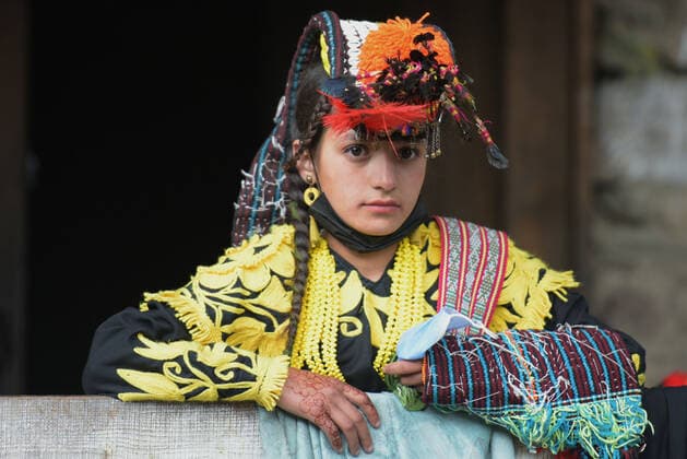 Pakistan: Chilmjushi Festival in the Kalsh Valley Kalashi women and men wearing traditional dresses participating in the dance during the Chilmjushi Festival in the Kalsh Valley. Chilum Joshi is also known as a Kalash spring festivals. Dressed up in newly knitted clothes with elaborate headgear and jewelry in vibrant colors , Kalasha women dance to traditional drumbeats during the chilum joshi festivals that concluded here at the scenic Bamburet valley on Sunday with fanfare. The four days event attracted an unprecedented number of tourists including a group of 22 Malaysian motorcyclists, besides the French, Australian and Italian nationals, on the concluding day of the festival young men women select their life partners while each day f Copyright: RanaxSajidxHussain