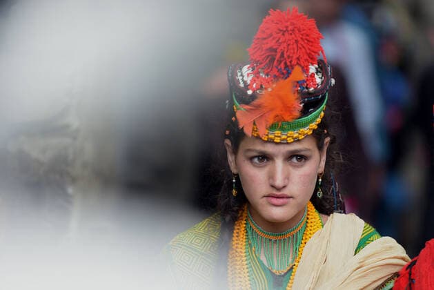 Pakistan: Chilmjushi Festival in the Kalsh Valley Kalashi women and men wearing traditional dresses participating in the dance during the Chilmjushi Festival in the Kalsh Valley. Chilum Joshi is also known as a Kalash spring festivals. Dressed up in newly knitted clothes with elaborate headgear and jewelry in vibrant colors , Kalasha women dance to traditional drumbeats during the chilum joshi festivals that concluded here at the scenic Bamburet valley on Sunday with fanfare. The four days event attracted an unprecedented number of tourists including a group of 22 Malaysian motorcyclists, besides the French, Australian and Italian nationals, on the concluding day of the festival young men women select their life partners while each day f Copyright: RanaxSajidxHussain