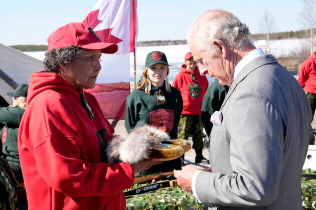May 19, 2022, Yellowknife, NT, CANADA: Prince Charles, right, is presented with a pair of moccasins made by a Canadian Ranger during a review of the Canadian Rangers in Yellowknife, Northwest Territories, during part of the Royal Tour of Canada, Thursday, May 19, 2022. Yellowknife CANADA - ZUMAc35_ 20220519_zaf_c35_193 Copyright: xPaulxChiassonx