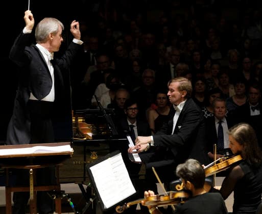 American conductor David Robertson, left, and Czech pianist Ivo Kahanek perform during the concert at the 77th Prague Spring international music festival in Prague, Czech Republic, May 20, 2022. (CTKxPhoto MichalxKrumphanzl) CTKPhotoP2022052008477  kru 3