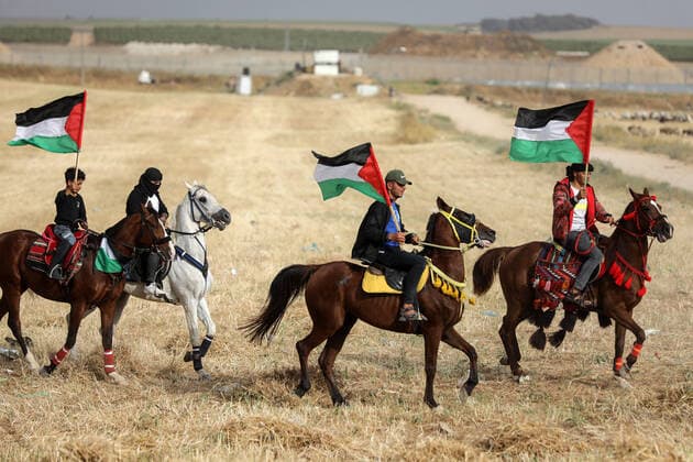 Nakba Day In Gaza Palestinians waving their national flags take part on horseback in a rally on the 74h anniversary of what the Palestinians call the Nakba, or catastrophe referring to their uprooting in the war over Israel s 1948 creation, east of Gaza City near the border with Israel, on May 21, 2022. Gaza Palestine  Copyright: xMajdixFathix originalFilename: fathi-notitle220521_npB76.jpg