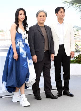 South Korean director Park Chan-Wook, actor Park Hae-Il and actress Tang Wei attend the photo call for Decision To Leave at Palais des Festivals at the 75th Cannes Film Festival, France on Tuesday, May 24, 2022.  CAN20220524131 RUNExHELLESTAD