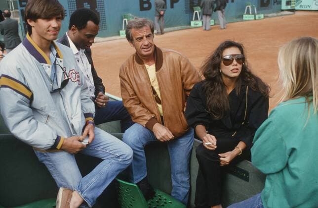 Jean-Paul Belmondo, 1986 Paul Belmondo, Jean-Paul Belmondo, Carlos Sotto Mayor, attending a match in the stands of the French Open. June 1986 Photo Jacques Loew Copyright: xJacquesxLoew Photo12x LWE21A00_001