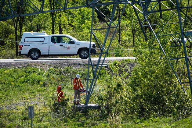 May 24, 2022, Ottawa, ON, CAN: A utility worker uses a cutting tool to sever a transmission tower from its base, after it was damaged in SaturdayöÄÃ s major storm in Ottawa, on Tuesday, May 24, 2022. Ottawa CAN  - ZUMAc35_ 20220524_zaf_c35_023 Copyright: xJustinxTangx