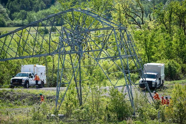 May 24, 2022, Ottawa, ON, CAN: Utility workers assess a transmission after it was damaged in SaturdayöÄÃ s major storm in Ottawa, on Tuesday, May 24, 2022. Ottawa CAN  - ZUMAc35_ 20220524_zaf_c35_024 Copyright: xJustinxTangx