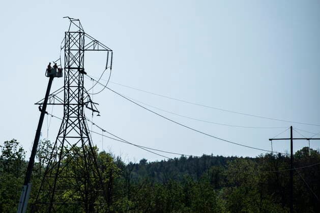 May 24, 2022, Ottawa, ON, CAN: Crews in a lift work remove segments from a damaged transmission tower, after SaturdayöÄÃ s major storm caused significant damage to the regionöÄÃ s power distribution network, in Ottawa, on Tuesday, May 24, 2022. Ottawa CAN  - ZUMAc35_ 20220524_zaf_c35_036 Copyright: xJustinxTangx