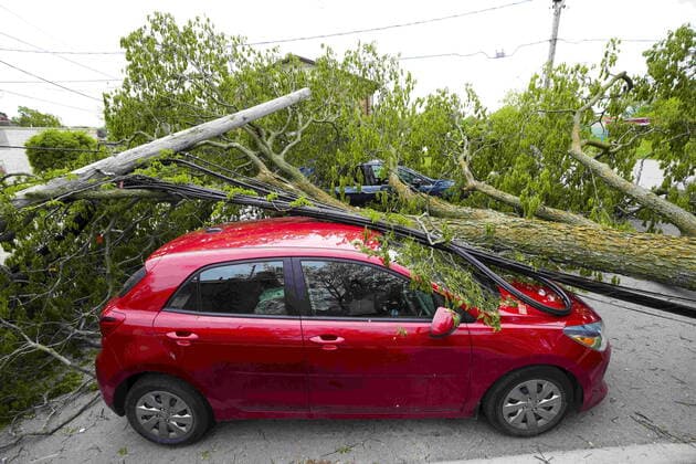 May 24, 2022, Carleton Place, Ontario, Canada: Vehicles remain crushed under trees and power lines in the Ottawa Valley community of Carleton Place, Ont. on Tuesday, May 24, 2022, after a major storm hit parts of Ontario and Quebec on Saturday leaving extensive damage. Carleton Place Canada  - ZUMAc35_ 20220524_zaf_c35_037 Copyright: xSeanxKilpatrickx