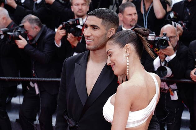 Achraf Hakimi - Hiba Abouk CELEBRITES : 75eme Festival de Cannes - Tapis rouge du film Â« L?Innocent et de la soiree anniversaire du 75eme festival Â» - 24 05 2022 NorbertScanella Panoramic 