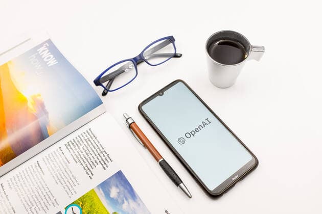 Logo Photo Illustration In this photo illustration an OpenAI logo seen displayed on a smartphone screen on a desk next to a cafe, a pen, glasses and a magazine in Athens, Greece on May 25, 2022. (Photo illustration by Nikolas Kokovlis NurPhoto) Athens Greece  Copyright: xNikolasxKokovlisx originalFilename: kokovlis-notitle220525_npBGZ.jpg