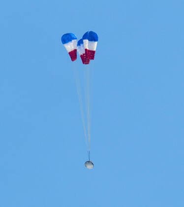 Boeing?s CST-100 Starliner spacecraft opens it?s main parachutes as it lands at White Sands Missile Range?s Space Harbor, Wednesday, May 25, 2022, in New Mexico. Boeing?s Orbital Flight Test-2 (OFT-2) is Starliner?s second uncrewed flight test to the International Space Station as part of NASA s Commercial Crew Program. OFT-2 serves as an end-to-end test of the system s capabilities. NASA and Boeing safely landed the company?s CST-100 Starliner spacecraft Wednesday in the desert of the western United States, completing the uncrewed Orbital Flight Test-2 (OFT-2) to the International Space Station to help prove the system is ready to fly astronauts. About four hours after departing the space station, Starliner touched down onto i Copyright: xNASA BillxIngallsx 51591866 EDITORIAL USE ONLY. NOT FOR USE BY NEWSPAPERS BASED IN THE UK.