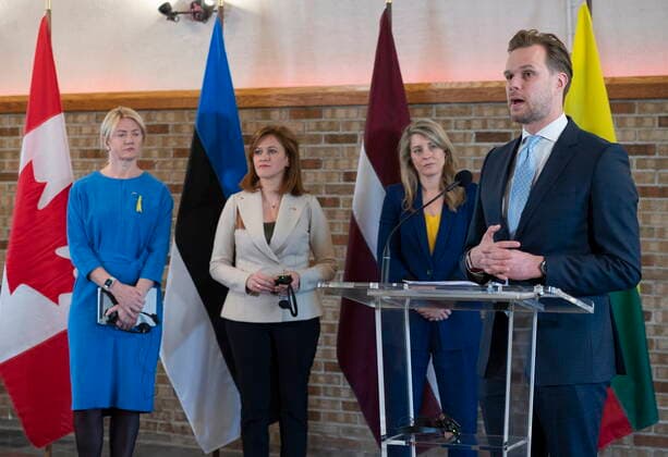 June 2, 2022, QUEBEC, PQ, Canada: Minister of Foreign Affairs of the Republic of Lithuania Gabrielius Landsbergis speaks at a news conference as he meets Melanie Joly, behind, Minister of Foreign Affairs and her counterparts from the Baltic region, Minister of Foreign Affairs of the Republic of Estonia Eva-Maria Liimets, left, and Zanda Kalnina-Lukasevica, centre, of LatviaöÄö Parliamentary Secretary of the Ministry of Foreign Affairs, Thursday, June 2, 2022 in Quebec City. QUEBEC Canada  - ZUMAc35_ 20220602_zaf_c35_054 Copyright: xJacquesxBoissinotx