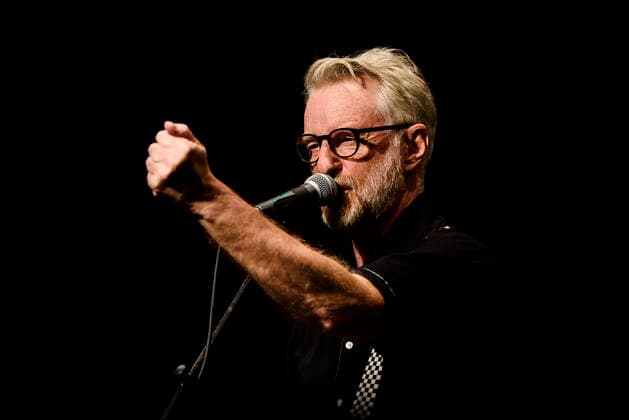 Concert of Billy Bragg in Berlin Three nights in a row Billy Bragg is at the Heimathafen Neukölln on stage and plays songs from all his creative phases On the second evening he went back to the early days and he played songs from his first three albums , Berlin Berlin Germany Neukölln