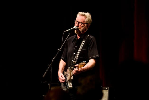 Concert of Billy Bragg in Berlin Three nights in a row Billy Bragg is at the Heimathafen Neukölln on stage and plays songs from all his creative phases On the second evening he went back to the early days and he played songs from his first three albums , Berlin Berlin Germany Neukölln