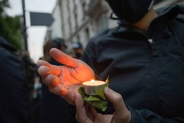 June 4, 2022, London, United Kingdom: A protester holds a lit candle during the demonstration at the Chinese Embassy. Hongkongers, Tibetans and Uyghurs joint force hold a candlelit vigil outside the Chinese Embassy in London on the 33rd anniversary of the Tiananmen Square Massacre. On 4th June 1989, Chinese troops armed with assault rifles and accompanied by tanks fired at the student demonstrators and those who were trying to block the military s advance into Tiananmen Square. As of today, the Chinese government still denies the incident has happened. London United Kingdom - ZUMAs197 20220604_zaa_s197_234 Copyright: xHestherxNgx