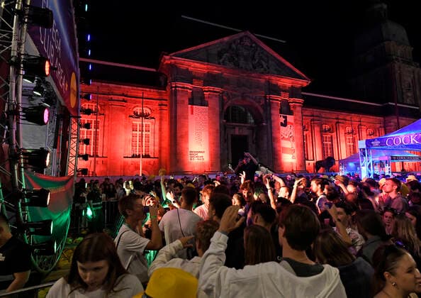 04 06 2022 Schlossgrabenfest Entega Club Area in front of red illuminated Hessian State Museum Darmstadt Hesse Germany