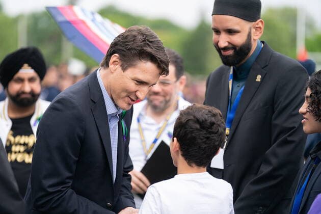 June 5, 2022, London, ON, Canada: Prime Minister Justin Trudeau greets a boy as he arrives for a ceremony and march in memory of the Afzaal family in London, Ont. on Sunday June 5, 2022. London Canada  - ZUMAc35_ 20220605_zaf_c35_024 Copyright: xGeoffxRobinsx