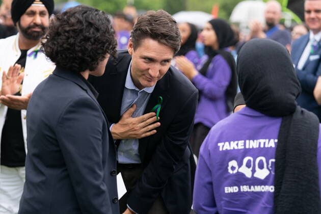 June 5, 2022, London, ON, Canada: Prime Minister Justin Trudeau thanks Maryam Al-Sabbawi following her speech during a ceremony and march in memory of the Afzaal family in London, Ont. on Sunday June 5, 2022. The march Sunday is to honour the Muslim family mowed down one year ago by a pickup truck driver while they took an evening walk. London Canada  - ZUMAc35_ 20220605_zaf_c35_038 Copyright: xGeoffxRobinsx