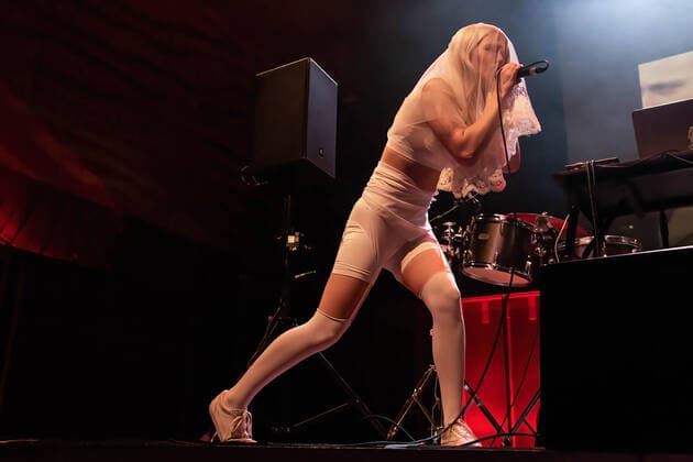 June 9, 2022, Porto, Portugal: Diana Burkot from the Russian activists group, Pussy Riot, performs at Casa da Musica, in Porto. Russian Activists part of a feminist punk rock group, Pussy Riot staged a music, dance performance at Casa da Musica with an aim to sell tickets whose profits would help in the construction of a paediatric hospital in Ukraine..Pussy Riot is a band known for holding concerts and political rally events, in favour of women s rights and an opponent of the Putin regime. Porto Portugal - ZUMAs197 20220609_zaa_s197_086 Copyright: xRitaxFrancax