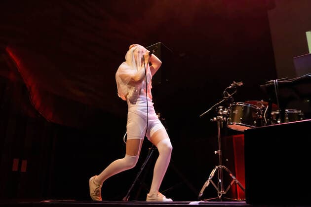June 9, 2022, Porto, Portugal: Diana Burkot from the Russian activists group, Pussy Riot, performs at Casa da Musica, in Porto. Russian Activists part of a feminist punk rock group, Pussy Riot staged a music, dance performance at Casa da Musica with an aim to sell tickets whose profits would help in the construction of a paediatric hospital in Ukraine..Pussy Riot is a band known for holding concerts and political rally events, in favour of women s rights and an opponent of the Putin regime. Porto Portugal - ZUMAs197 20220609_zaa_s197_081 Copyright: xRitaxFrancax