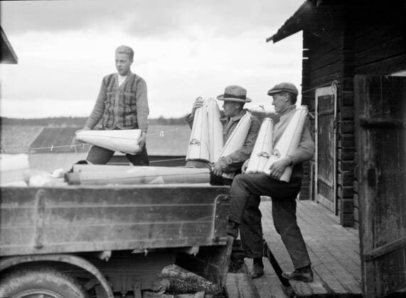Finland History - Employees of Keitele Cooperative Store loading sugar loaves on to a lorry. ca. 1930s or 1940s Keitele, Pohjois-Savo, Finland 1062_05_M_-11808-
