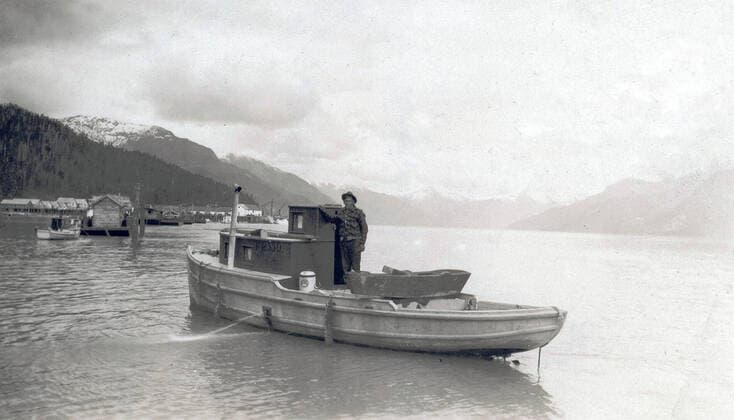 Title: View of Emil Colman aboard his boat on the Skeena River, B.C : UBC Library 1062_16_M_-12816-