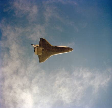(30 March 1982) --- This unique view of the underside of the space shuttle orbiter Columbia was taken with a handheld camera aboard a T-38 chase plane over the White Sands Missile Range in New Mexico. 1062_36_M_-11506-