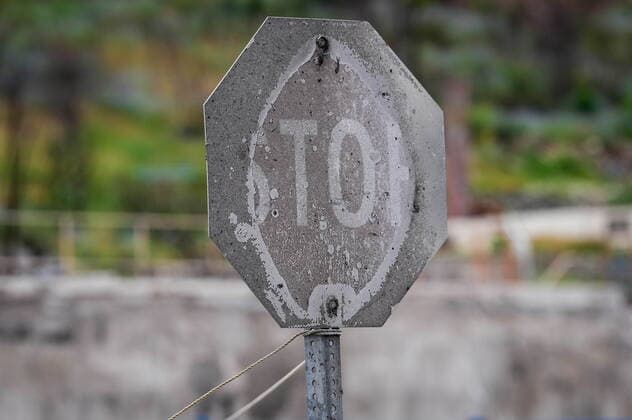 June 14, 2022, LYTTON, BC, CANADA: A stop sign that was burned by wildfire is seen, in Lytton, B.C., on Tuesday, June 14, 2022. The fire-ravaged community of Lytton, B.C., will get $77 million from the federal government to help it rebuild a fire-resistant and energy-efficient community. Two people were killed and much of the centre of the village was destroyed when wildfire ripped through the community almost a year ago. LYTTON CANADA  - ZUMAc35_ 20220614_zaf_c35_094 Copyright: xDarrylxDyckx