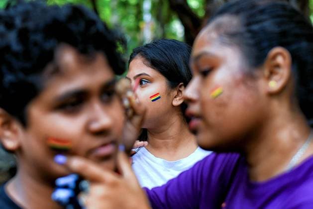 June 19, 2022, Kolkata, India: Young couple of the LGBT Community seen painting their faces with Pride Colors before the parade. Lesbian, Gay, Bisexual and Transgender Pride Month is celebrated annually in June to honour the 1969 Stonewall riots and to strengthen the voice for equality irrespective of gender, sexuality, religion, community and orientation. Kolkata India - ZUMAs197 20220619_zaa_s197_002 Copyright: xAvishekxDasx