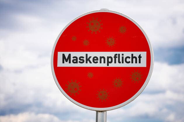 20 June 2022: Sign with the inscription mask obligation, obligation to wear a medical protective mask, mouth-nose protection PHOTOMONTAGE