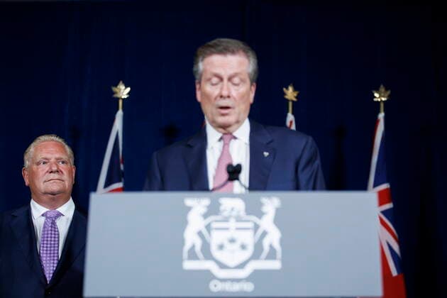 June 27, 2022, TORONTO, ON, Canada: Ontario Premier Doug Ford looks on while Toronto Mayor John Tory speaks during a joint press conference inside QueenöÄÃ s Park in Toronto, Monday, June 27, 2022. TORONTO Canada  - ZUMAc35_ 20220627_zaf_c35_048 Copyright: xColexBurstonx