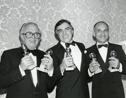 Richard Attenborough, John Briley and Ben Kingsley Los Angeles.CA.USA. LIBRARY. Richard Attenborough, John Briley and Ben Kingsley with their Golden Globe awards. 29th January 1983. LMK30-SLIB300622PBOR-001 