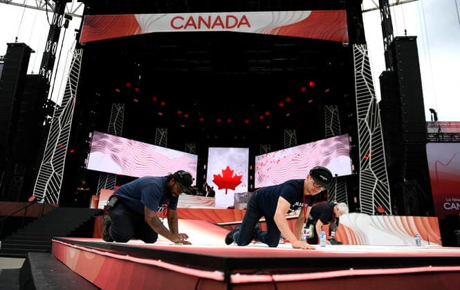 July 1, 2022, Ottawa, ON, CAN: Crews scrub a section of the stage as they make last minute preparations before the start of Canada Day celebrations at Lebreton Flats in Ottawa, on Friday, July 1, 2022. Ottawa CAN  - ZUMAc35_ 20220701_zaf_c35_027 Copyright: xJustinxTangx