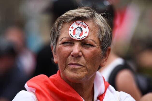 July 1, 2022, Ottawa, ON, Canada: A protestor protesting against COVID-19 health measures is seen with a sticker on her forehead reading Wanted Trudeau4Treason in reference to Prime Minister Justin Trudeau during a demonstration in the downtown core of Ottawa, Ont. during Canada Day celebrations on Friday, July 1, 2022. Ottawa Canada  - ZUMAc35_ 20220701_zaf_c35_062 Copyright: xSpencerxColbyx