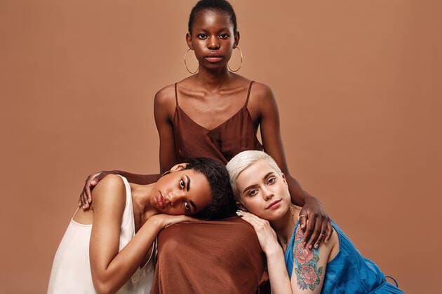 Creative Highlights Symbolbilder Three beautiful women posing together in a studio wearing dresses Copyright: xxArtemxVarnitsinx