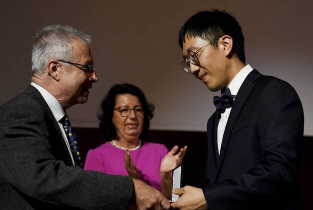 June Huh (right) receives the Fields Prize for Mathematics from IMU President Carlos E. Kenig during the prize ceremony of the International Congress of Mathematicians 2022 (ICM 2022) in Helsinki, Finland, on July 5, 2022. Helsinki Finland  Copyright: xVesaxMoilanenx LKLAPV20220705101717P818