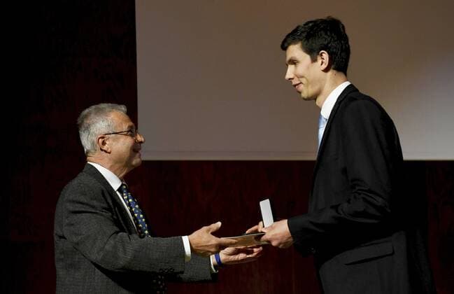 James Maynard (right) receives the Fields Prize for Mathematics from IMU President Carlos E. Kenig during the prize ceremony of the International Congress of Mathematicians 2022 (ICM 2022) in Helsinki, Finland on July 5, 2022. Helsinki Finland  Copyright: xVesaxMoilanenx LKLAPV20220705101818O859