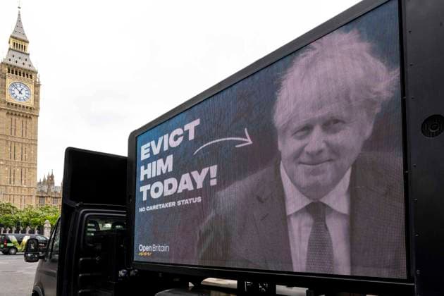 (220708) -- LONDON, July 8, 2022 -- A screen shows a poster against British Prime Minister Boris Johnson in London, Britain, July 7, 2022. British Prime Minister Boris Johnson resigned on Thursday after the support for him evaporated amid an avalanche of ministerial resignations over his scandal-hit leadership. (Photo by Xinhua) BRITAIN-PM-BORIS JOHNSON-RESIGN StephenxChung 