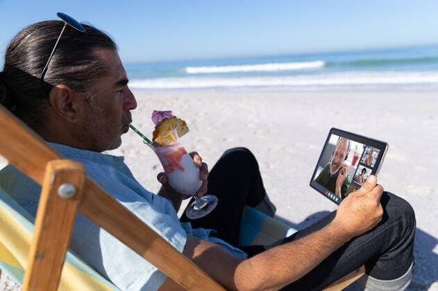 Caucasian man relaxing on beach with drink having video call using tablet Caucasian man relaxing on beach with drink having video call using tablet. digital nomad on summer beach holiday., model released, , property released, Cork, Ireland, 2021-05-07T08:27:55.000Z, 1440389.jpg, people,caucasian man,relaxing,beach holiday,drink,video call,using tablet,digital nomad,summer beach,holiday,beverage,celebration,food,vacation,cup,coffee,christmas,happy,cafe,glass,breakfast,party,decoration,alcohol,fresh,summer,table,liquid,restaurant,hot,caucasian,man,beach,video,call,using,tablet,digital,nomad Mature Adult,Man,Male,Caucasian,Mid Adult,Young Adult,Woman,Female,Black