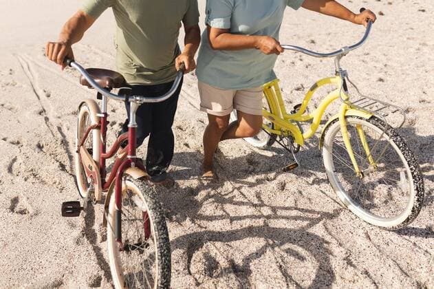 Low section of multiracial senior couple wheeling bikes on sand at beach during sunny day Low section of multiracial senior couple wheeling bikes on sand at beach during sunny day. active lifestyle and transportation., model released, , property released, Cape Town, South Africa, 10.11.2021, 3087072.jpg, people,low section,multiracial,senior couple,wheeling,bike,sand beach,sunny day,active lifestyle,transportation,bicycle,transport,vehicle,biking,cyclist,ride,cycle,biker,road,car,traffic,speed,motorcycle,wheel,rider,drive,motorbike,travel,street,race,low,section,senior,couple,sand,beach,sunny,day,active,lifestyle Senior,Elderly,Man,Male,Mixed-Race,Woman,Female