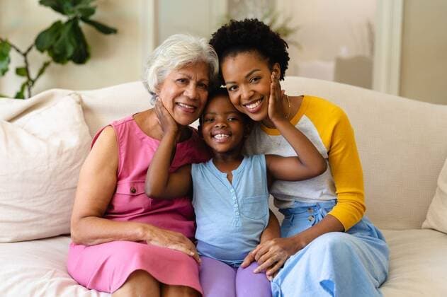 Portrait of african american grandmother, mother and granddaughter smiling sitting on couch at home Portrait of african american grandmother, mother and granddaughter smiling sitting on couch at home. family, love and togetherness concept, unaltered., model released, , property released, Cape Town, South Africa, , 3098332.jpg, people,portrait,african american,grandmother,mother,granddaughter,smiling,sitting,couch,home,family,love,togetherness,concept,unaltered,happy,together,young,parent,happiness,daughter,cheerful,adult,kid,lifestyle,childhood,person,cute,mom,sofa,couple,little,smile,indoors,african,american Senior,Elderly,Woman,Female,Black,Mid Adult,Child,Girl