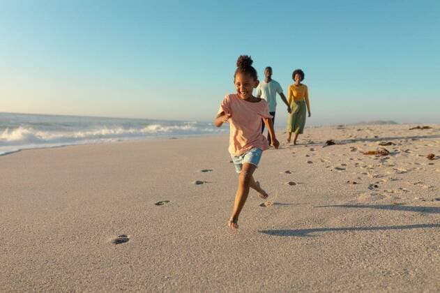 IMAGO Creative: Lokalhelden - Jugendsportbildung Happy african american girl running on sand against parents walking at beach Happy african american girl running on sand against parents walking at beach. unaltered, family, lifestyle, togetherness, enjoyment and holiday concept., model released, , property released, Cape Town, South Africa, , 3137256.jpg, people,happy,african american,american girl,running,sand,parent,walking,beach,unaltered,family,lifestyle,togetherness,enjoyment,holiday concept,young,mother,happiness,together,fun,sea,ocean,vacation,leisure,coast,daughter,person,cheerful,kid,adult,childhood,smiling,smile,joy,african,american,girl,holiday,concept Child,Girl,Female,Black,Young Adult,Man,Male,Woman