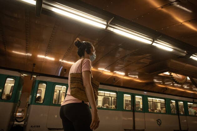 (220709) -- PARIS, July 9, 2022 -- A woman wearing a face mask to protect against COVID-19 waits at a subway station in Paris, France, July 8, 2022. The total number of COVID-19 related deaths in France passed the 150,000 mark on Friday, after 74 deaths related to the virus were recorded in hospitals in the past 24 hours, announced the country s public health agency. (Photo by Xinhua) FRANCE-PARIS-COVID-19-DEATH AurelienxMorissard 