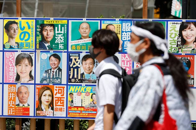 July 10, 2022, Tokyo, Japan: People walk past candidate posters for the Upper House election outside Takadanobaba Station. The House of Councilors election is held on July 10. Tokyo Japan - ZUMAm191 20220710_zap_m191_029 Copyright: xRodrigoxReyesxMarinx