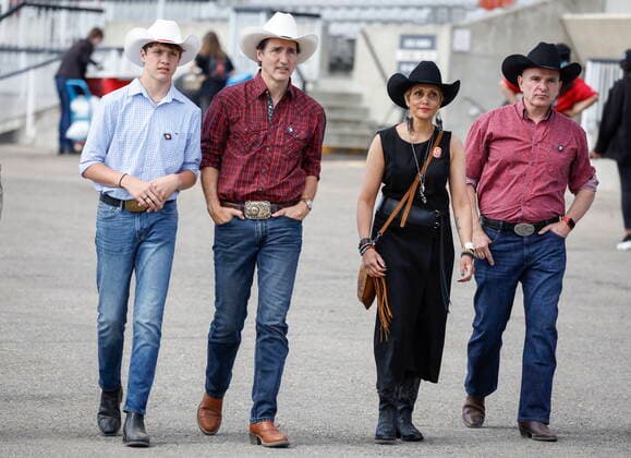 July 10, 2022, Calgary, AB, CANADA: Prime Minister Justin Trudeau, second left, walks with his son Xavier, left, and Calgary mayor Jyoti Gondek, centre right, at the Calgary Stampede in Calgary, Alta., Sunday, July 10, 2022. Calgary CANADA - ZUMAc35_ 20220710_zaf_c35_028 Copyright: xJeffxMcintoshx