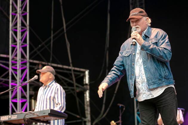 The Beach Boys Sixty Years of the Sound of Summer with Bruce Johnston li , keyboards from 1965, born 27 June 1942 in Chicago, Illinois, as Billy Baldwin and the last remaining founding member Mike Love re , lead vocals, born 15 March 1941 in Los Angeles, California as Michael Edward Love live during an open air performance at the Freilichtbühne Junge Gar
