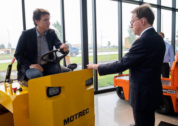 July 12, 2022, Sherbrooke, PQ, Canada: Prime Minister Justin Trudeau talks with CEO of Motrec Blair McIntosh as he takes a tour the heavy-duty electric vehicle production facility in Sherbrooke, Que., Tuesday, July 12, 2022. Sherbrooke Canada  - ZUMAc35_ 20220712_zaf_c35_015 Copyright: xGrahamxHughesx