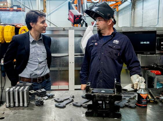 July 12, 2022, Sherbrooke, PQ, Canada: Prime Minister Justin Trudeau talks with a worker during a tour of Motrec, a heavy-duty electric vehicle production facility in Sherbrooke, Que., Tuesday, July 12, 2022. Sherbrooke Canada  - ZUMAc35_ 20220712_zaf_c35_026 Copyright: xGrahamxHughesx