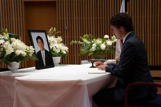 July 12, 2022, Ottawa, ON, Canada: Canadian Prime Minister Justin Trudeau pauses as he signs a book of condolences for former Japanese Prime Minister Shinzo Abe at the Japanese embassy, Tuesday, July 12, 2022 in Ottawa. Ottawa Canada  - ZUMAc35_ 20220712_zaf_c35_100 Copyright: xAdrianxWyldx