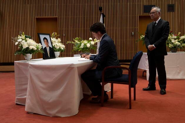 July 12, 2022, Ottawa, ON, Canada: Japanese Ambassador to Canada Kanji Yamanouchi looks on as Prime Minister Justin Trudeau signs a book of condolences for former Japanese Prime Minister Shinzo Abe at the Japanese embassy, Tuesday, July 12, 2022 in Ottawa. Ottawa Canada  - ZUMAc35_ 20220712_zaf_c35_107 Copyright: xAdrianxWyldx