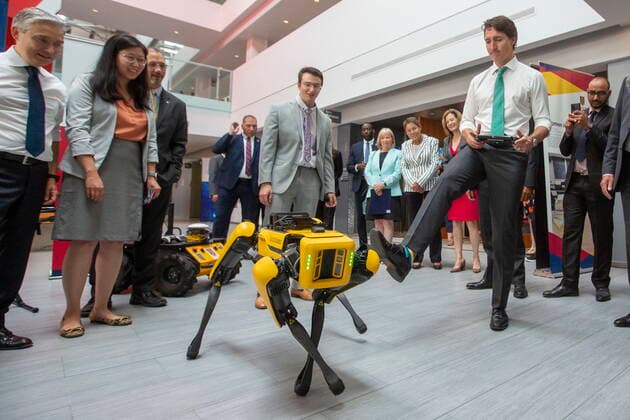 July 13, 2022, Kingston, Ontario, Canada: Prime Minister Justin Trudeau tries to move a Boston Dynamics robot during an electric battery announcement at QueenöÄÃ s University in Kingston, Ont., on Wednesday July 13, 2022. Kingston Canada  - ZUMAc35_ 20220713_zaf_c35_025 Copyright: xLarsxHagbergx